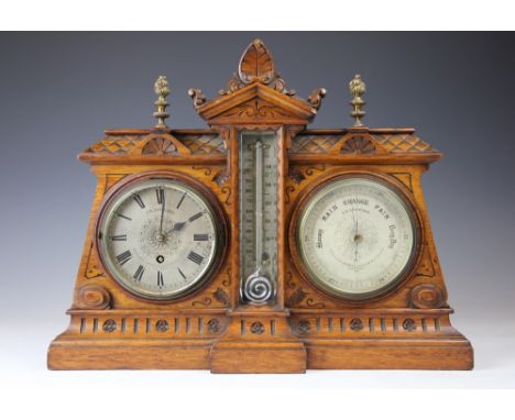 A late Victorian oak cased combination time piece, barometer and thermometer, the time piece and barometer with silvered Roma
