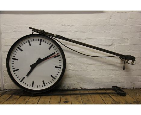 A large double sided station clock formerly from Shrewsbury Station, Shropshire, each 59cm perspex dial with a glass front an
