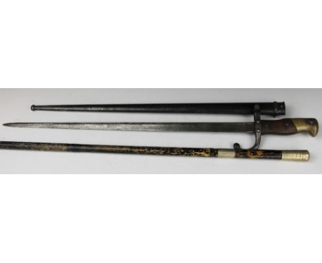 A late 19th century French Gras bayonet, 52cm, St Etienne blade dated 1879, with an Edwardian sword stick by Crawley & Sons M