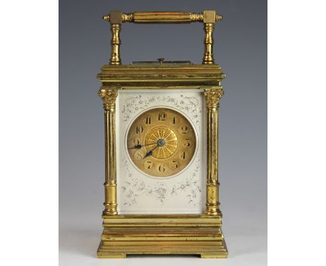 A late 19th century French lacquered brass repeating carriage clock, gilt Arabic numeral dial with a filigree centre, within 