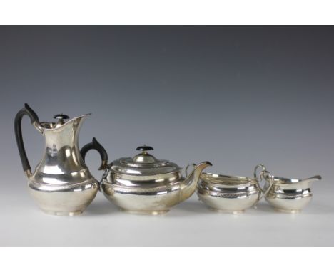 A silver four piece tea service, Viners Ltd, Sheffield 1959, each piece of oval rounded form with engraved band, comprising t