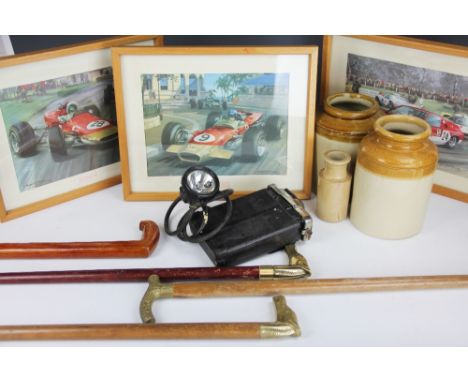 Four walking sticks, three stoneware vessels, a brass magazine rack, a graduated set of three tapestry suitcases, a miners la