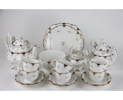 A 19th century Rockingham style eighteen piece part tea service, with gilt detailing