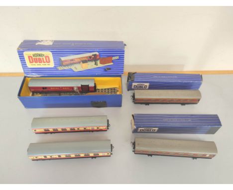 Quantity of vintage Hornby Dublo OO gauge rolling stock to include boxed T.P.O Mail Van Set 32099, two boxed D12 Corridor Coa