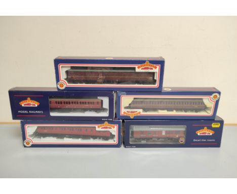 Five&nbsp;boxed Bachmann OO gauge railway carriages comprising of 57' BR MK1 Suburban Crimson 34-600, BR MK1 BSK/Maroon 39-07