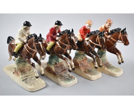 Two Pairs of Continental Ceramic Studies, Children on Horses, 18cm long 