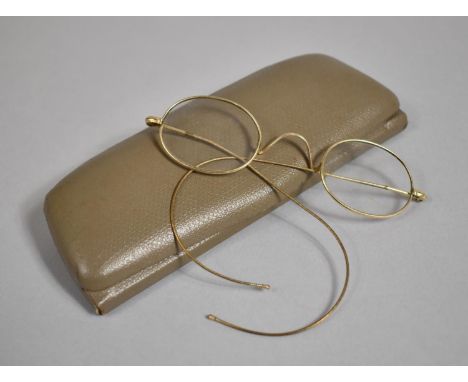 A Pair of Vintage Yellow Metal Framed Spectacles 
