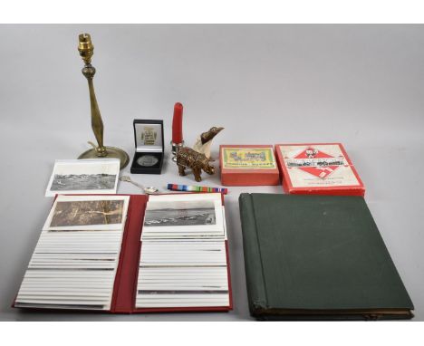 A Collection of Various Curios to Include Game Pieces, Album of Postcards, Brass Table Lamp, Candle Stick, Stamp Album and Co