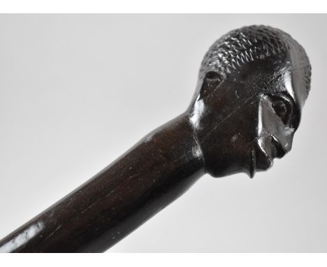 A Carved African Ebonised Barley Twist Walking Stick with Mask Head Handle 