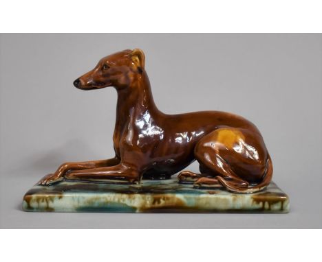 A Mintons Majolica Study of Greyhound on Rectangular Mottled Enamel Plinth Base. 19cms Wide 