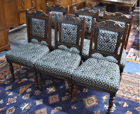 A Set of Six Late Victorian Carved Mahogany Dining Chairs with Button Upholstery 