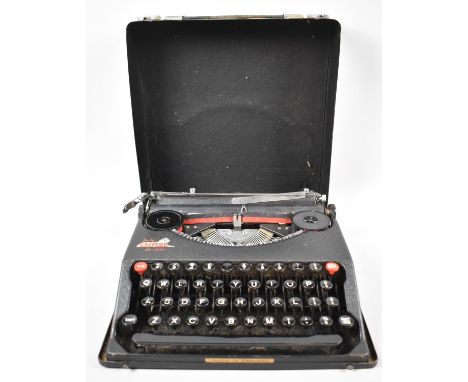 A Vintage Baby Empire Deluxe Portable Manual Typewriter 
