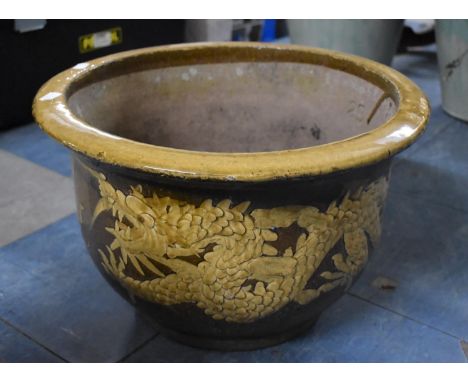 A Glazed Terracotta Planter Decorated with Dragons and Flaming Pearl, 43cm Diameter 