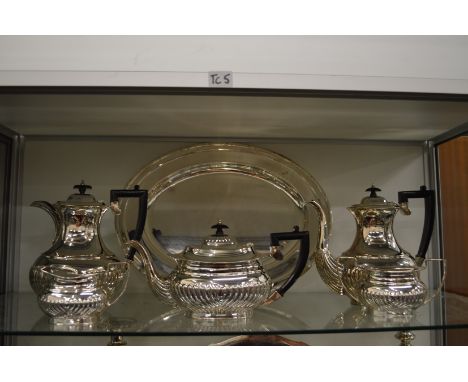 A Mappin and Webb five piece tea and coffee service together with a similar oval tray.