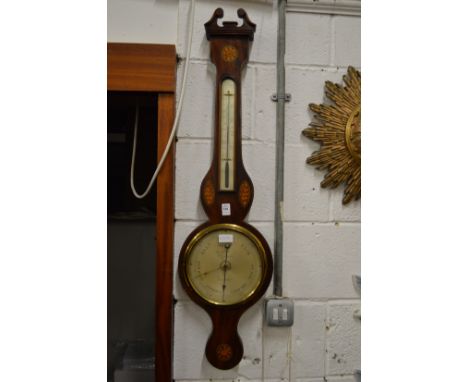 A mahogany barometer/thermometer.
