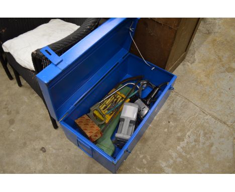 A metal trunk containing tools.