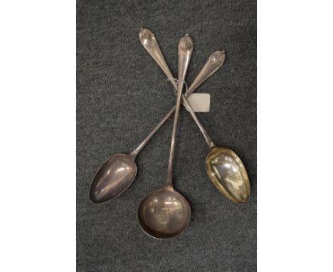 A pair of plated basting spoons and matching ladle.