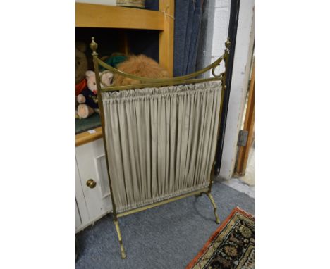 A brass firescreen.