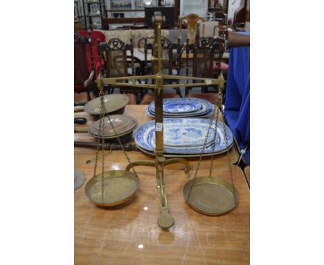 A set of brass balance scales.