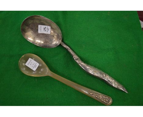 A Continental white metal ladle and a horn spoon.