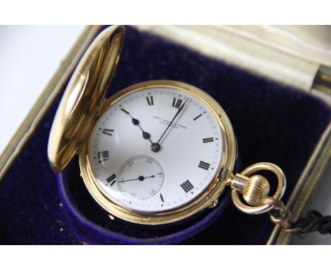 A late Victorian 18ct gold half hunter pocket watch, enamel Roman numeral dial and subsidiary seconds, signed by the retailer