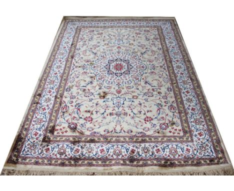 A Kashmir carpet worked with an all over foliate design against a gold ground, 225cm x 156cm