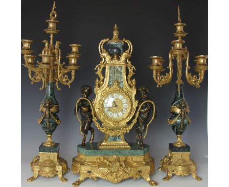 A modern Louis XV style marble and gilt brass clock garniture, with movement signed Franz Hermle and striking on a bell, the 