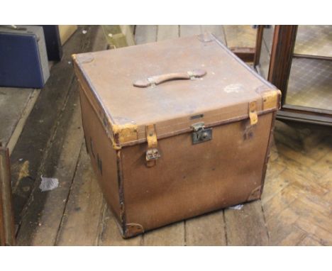 An Erskine & Sons leather mounted canvas trunk, of cube form, with brass bracketed handle and initialled L.N, 52cm H x 61cm W