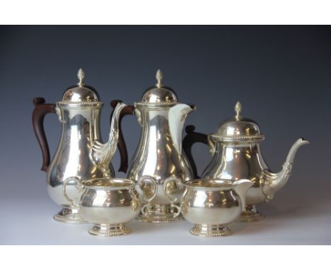 A silver five piece tea and coffee service, comprising tea pot, hot water pot, coffee pot, all with stained cream jug and sug