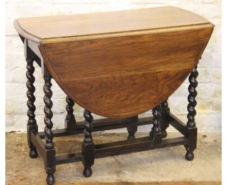 A 1920's oak gate leg table, on barley twist legs, 72cm H x 90cm W x 43cm D