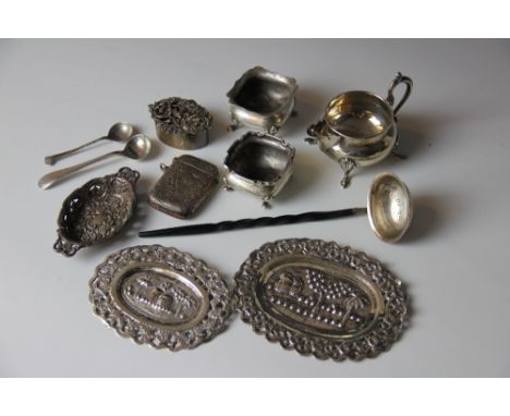 A collection of silver items comprising a silver cream jug, Chester 1907, a George III silver toddy ladle with baleen handle,