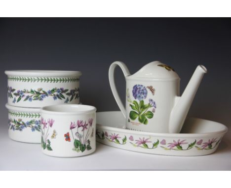 A collection of Portmeirion Botanic Garden kitchen wares, comprising a vase, a watering can, two oven dishes, an oval oven di