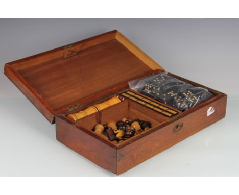 A Victorian mahogany games compendium, containing an assembled collection of thirty two boxwood and rosewood chess pieces, do