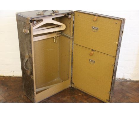 An Oshkosh gentlemans steamer trunk, with fitted interior (at fault), 93cm H x 51cm W x 31cm D