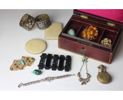 A collection of jewellery to include a gilt brass and enamel buckle, a marcasite set cocktail watch, a malachite head charm, 