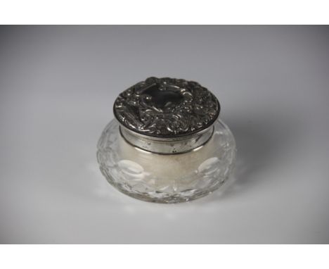 A silver topped cut glass powder puff jar, W I Broadway & Co, Birmingham 1983, the cover embossed with birds and scrolling fo