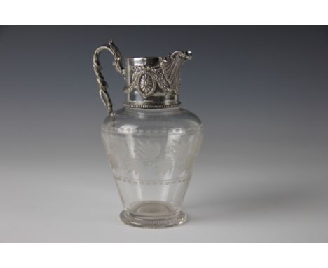 A Victorian silver plate mounted glass jug, with garland and acanthus scroll detail and shell moulded spout, engraved floral 