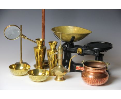A collection of copper and brass wares, to include measures, bowls and stands, with a set of cast iron scales etc