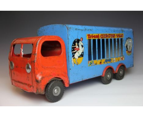 A large Tri-Ang pressed steel 300 series circus van, red cab with blue back and black tyres, white rear tailgate and Tri-Ang 