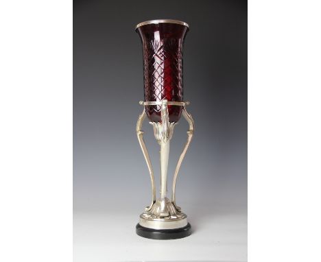 A modern Indian white metal and ruby glass storm candlestick, supported on a fluted column and circular base, 53cm