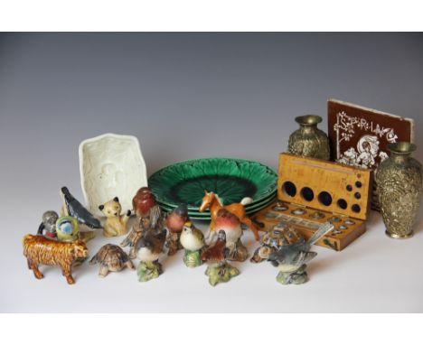 A 19th century Davenport jelly mould, decorated with Prince of Wales feathers, six Wedgwood majolica green leaf plates, a Min