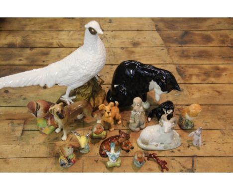 A collection of animal models to include, a large arctic pheasant, a Beswick terrier, two German dachshunds, a Beswick barn o