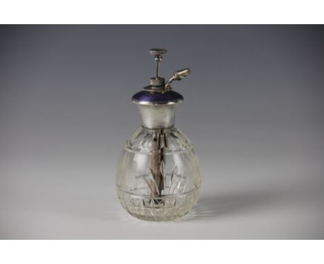 A sterling silver perfume atomiser, circa 1920 with lavender guilloche enamel detail and faceted glass base, 14.5cm high