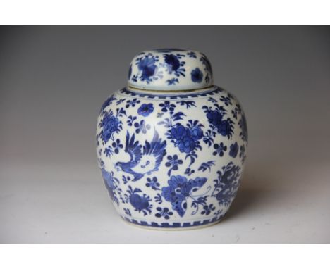 A late 19th century Chinese blue and white ginger jar and associated cover, decorated with butterflies and flowers, 15cm