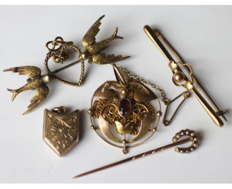 A late Victorian 15ct gold and diamond set brooch modelled with two doves, a 15ct gold and split pearl set horse shoe stick p