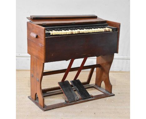 A mahogany cased harmonium, height 76cm, width 82cm, depth 36cm.   Provenance: From the collection of Gerry RobinsonGerry Rob