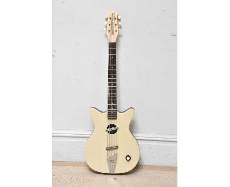 DANELECTRO; a 59 electro acoustic guitar, serial number 029902377, cased.  Provenance: From the collection of Gerry RobinsonG