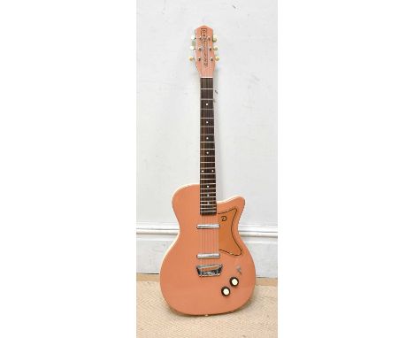DANELECTRO; a U-2 reissue electric guitar, cased.  Provenance: From the collection of Gerry RobinsonGerry Robinson was a foun