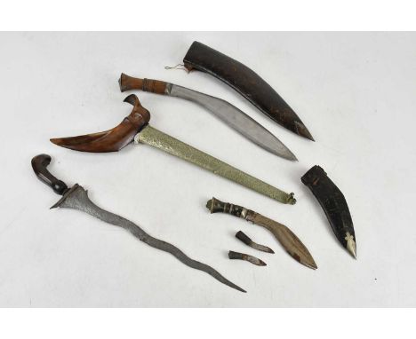 A Japanese kris with metal scabbard, overall length 48cm, and two kukri knives (3).