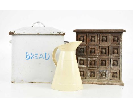 A modern carved hardwood specimen chest of sixteen drawers, height 31cm, a vintage enamel bread bin and modern enamel jug (3)